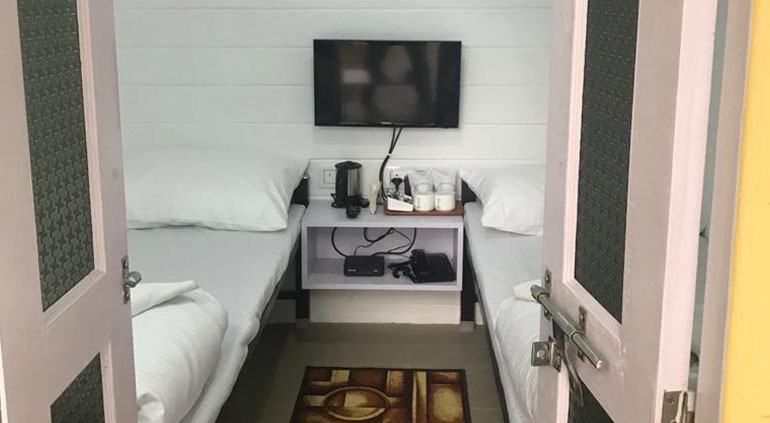 The inside of an Igloo with two clean beds at budget rates of accommodation